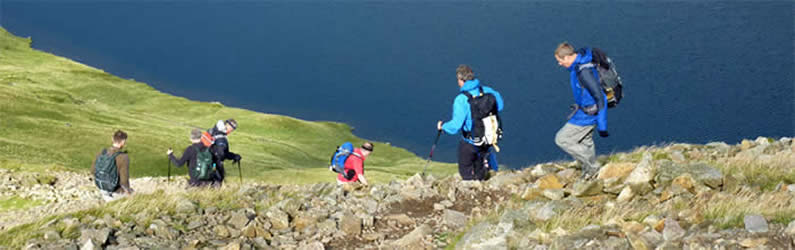 Walkers above Grisedale Tarn