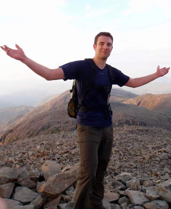 Scafell Pike summit cairn on a sunny day