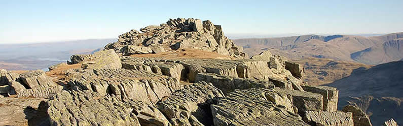 Weather beaten rocks on lower Striding Edge facing Ullswater